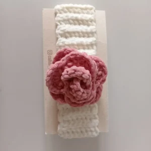 Handmade crochet baby headband with soft white band and blush pink crochet flower, premium handcrafted hair accessory by Calissi